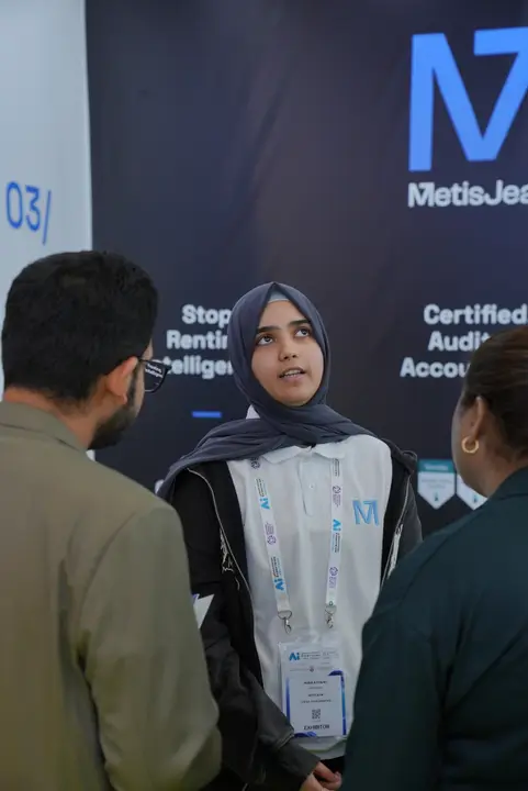 MetisJean at AI Everything Abu Dhabi: Amna explaining Jean to visitors at the stand