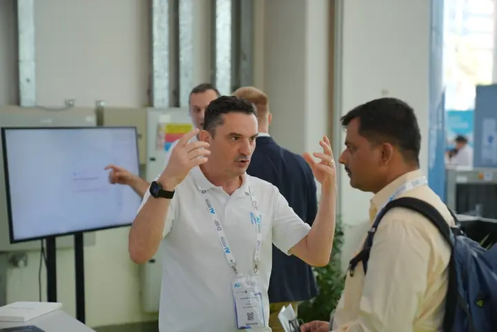 MetisJean at AI Everything Abu Dhabi: a visitor being walked through Jean on the stand's screen