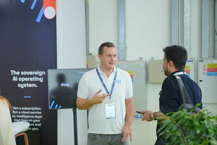 MetisJean at AI Everything Abu Dhabi: in front of the wall that reads The sovereign AI operating system