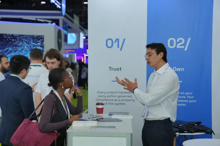 MetisJean at AI Everything Abu Dhabi: a visitor at the Trust panel, mid-question